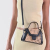 TROPEZ CROSSBODY BLACK NATURAL CANE | Dolce Vita