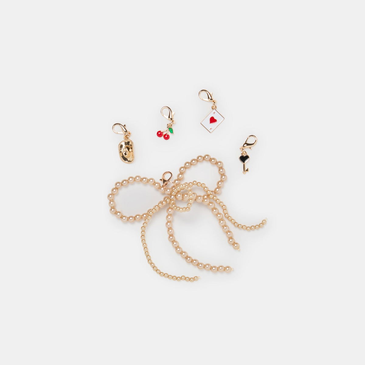 GOLD BOW CHARM PACKAGE ASSORTED | Dolce Vita